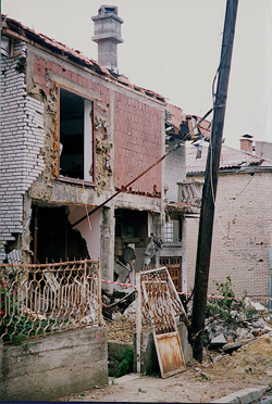 Image of a house in Pristina, Kosova a few days after the war ended, photo by author.