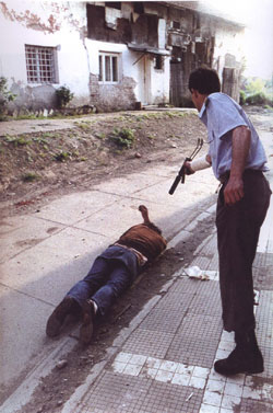 Courtesy of the ICTY. Goran Jelisic (self-named "the Serb Adolf") executes a prisoner in Brcko, Bosnia-Herzegovina.